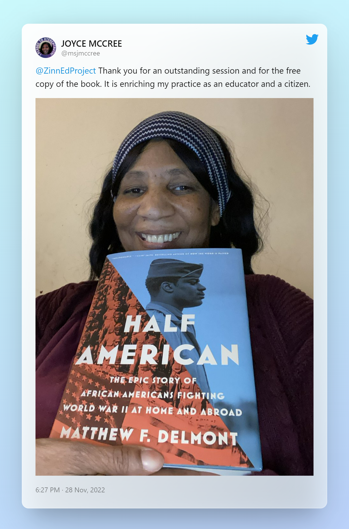 A twitter post from Joyce McCree with a picture of her holding the book Half American