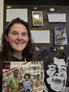 An educator holding Rethinking Schools issue on "Teaching About Redlining"