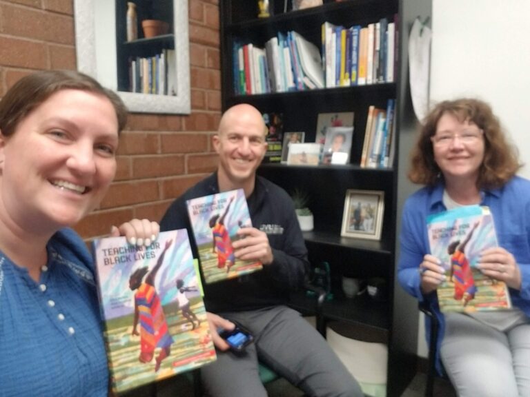 educators sitting with Teaching for Black Lives books