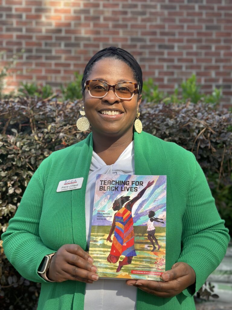 Alana Ward holding Teaching for Black Lives book